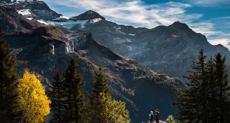 man standing looking at a mountain