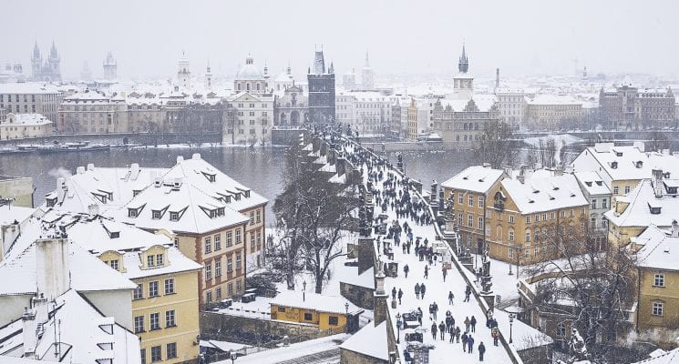 snow on the charles bridge in prague