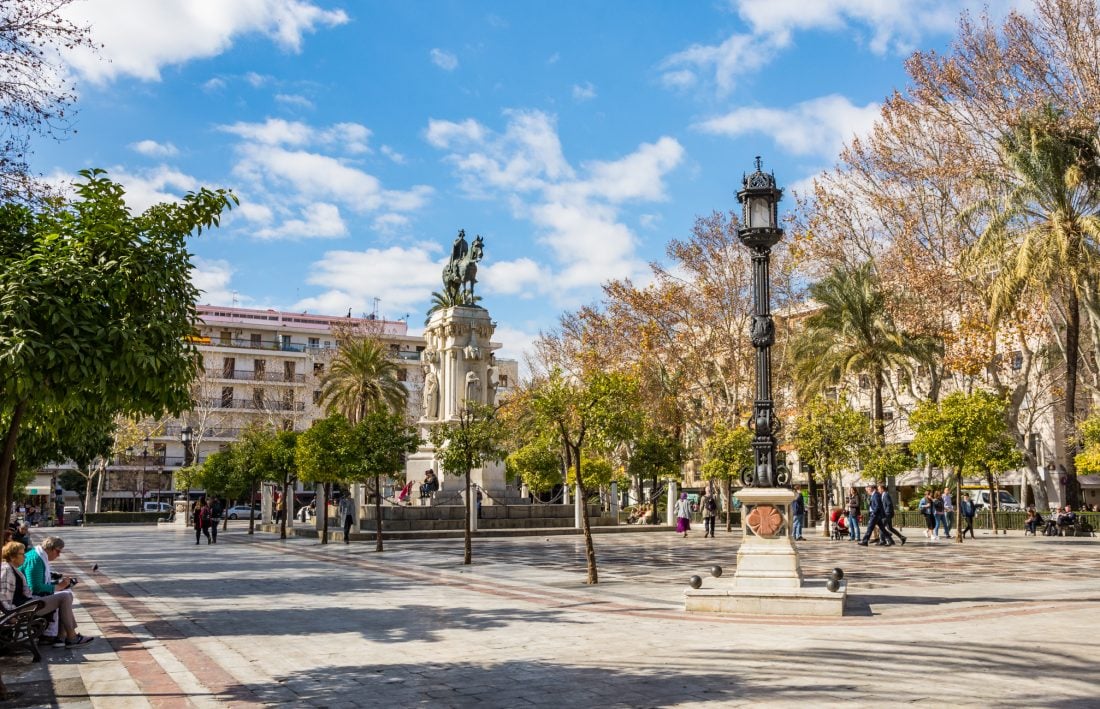 People in the Plaze Nueva in Sevilla, Spain.