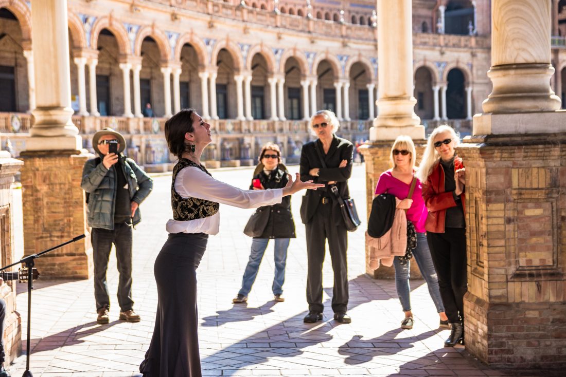 A woman singing and dancing flamenco in Plaza de Espana, Sevilla
