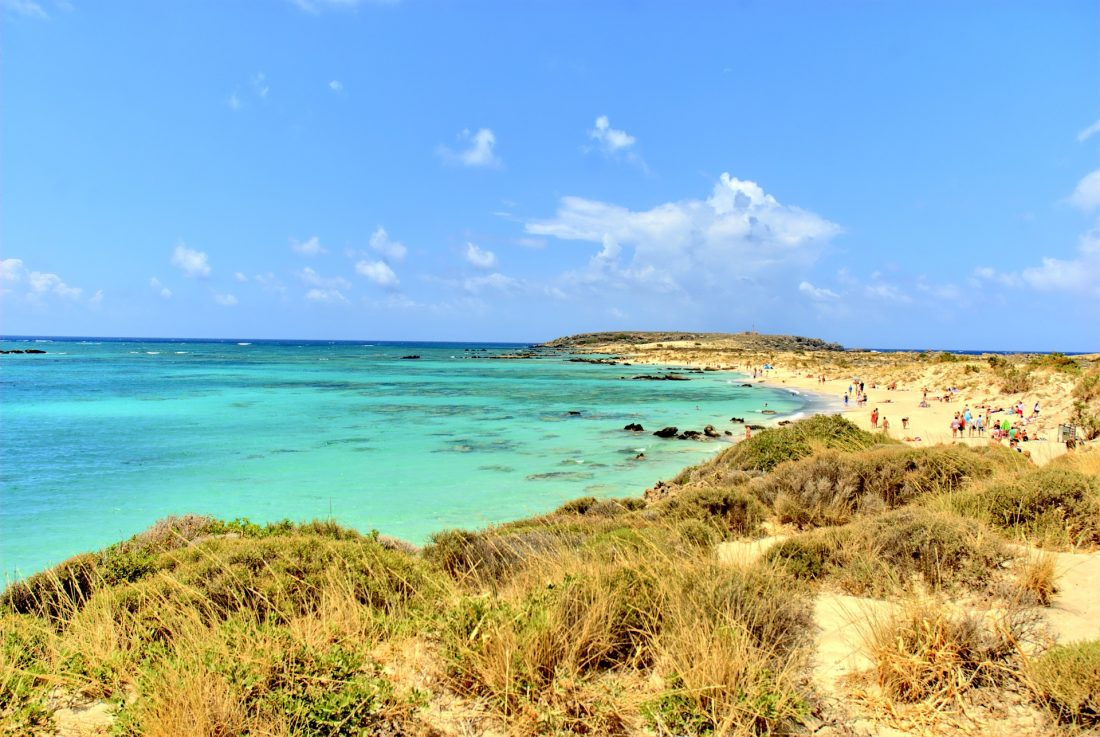 people on the yellow sands of Elafonisi Beach, Crete