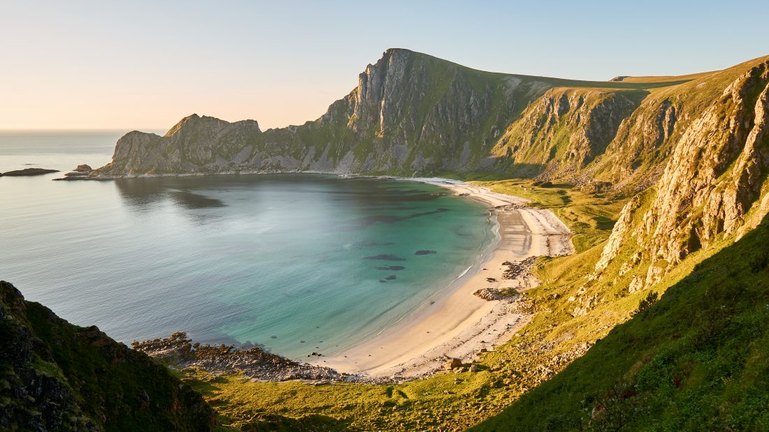 Wide angle shot of the coast and cliffs of Høyvika Beach, Andøya
