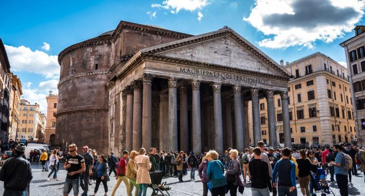 People standing in front of the Pantheon in Rome, Italy.
