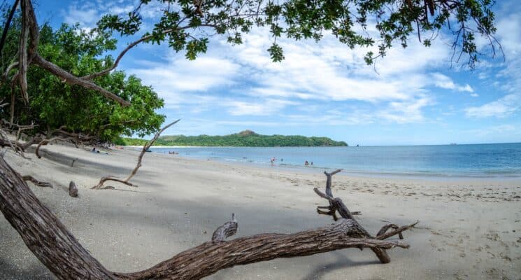 picture of a beach in costa rica on a partly cloudy day
