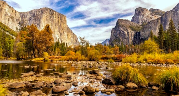 a creek and mountains in Yosemite National Park