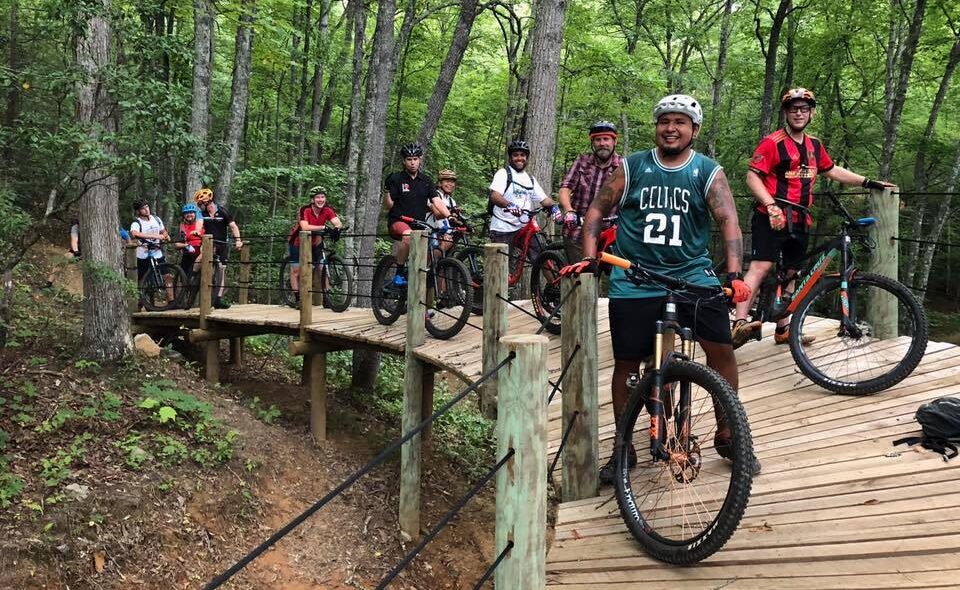 people on mountain bikes on a trail 