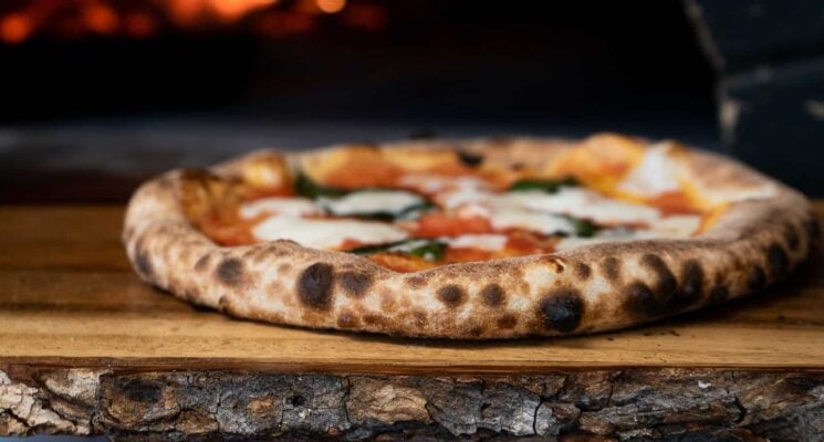 pizza coming out of a over