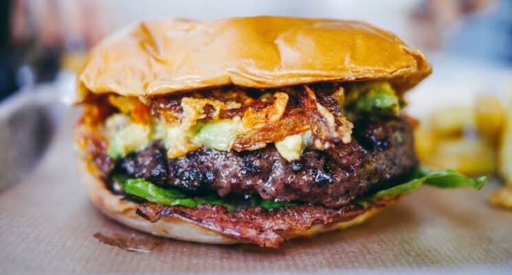 Close up of a smash cheese burger in a restaurant in Prague