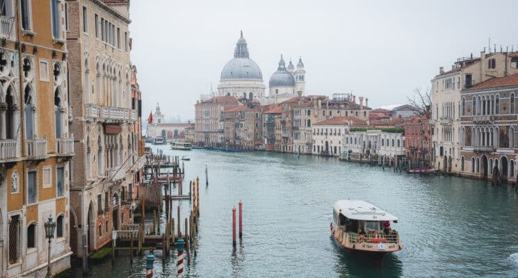 A boat on the canal in front of Santa Maria Basilica in Venice