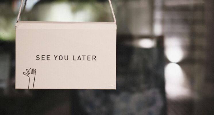 A hanging door sign that says "see you later"