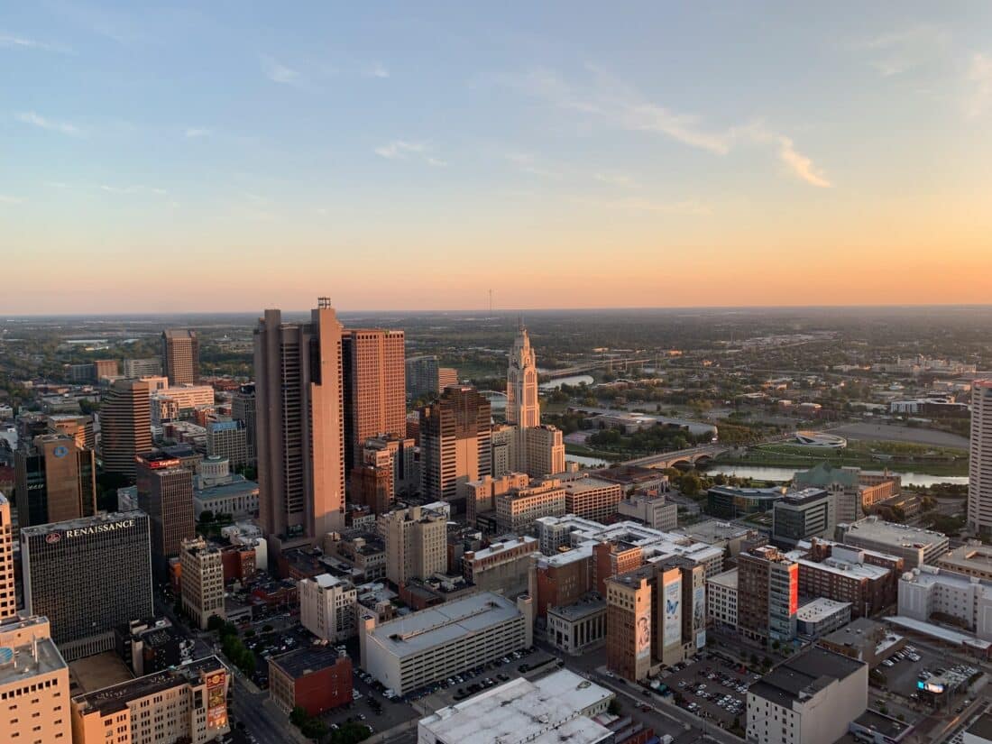 The city skyline of Columbus, one of the best day trips from Cincinnati, during sunset.