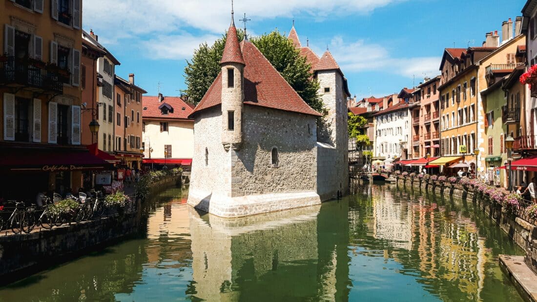 The Palais de L'ile, a former island prison, in Annecy, one of the best underrated cities to visit in Western Europe in 2025.