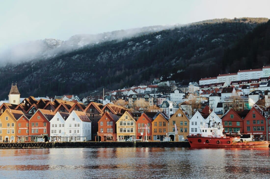 Colorful wooden houses on the harbor in Bergen, Norway, one of the best underrated cities to visit in Western Europe.